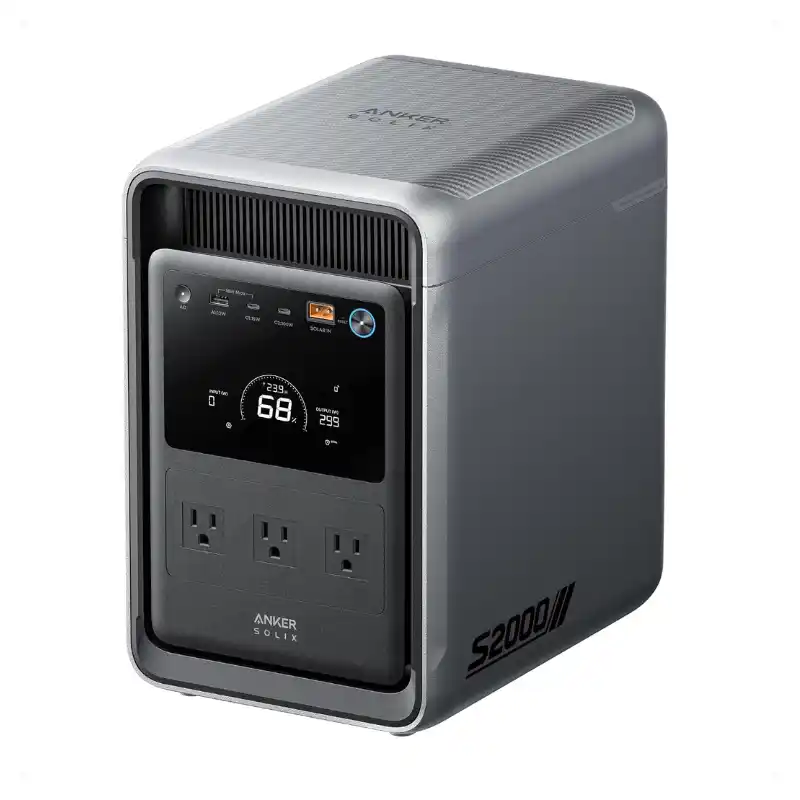 A studio product photo of the compact Anker SOLIX S2000 portable power station against a white background, showing its vertical dark gray chassis, silver-gray metallic trim, front LCD display showing 68% battery capacity, three AC outlets, USB ports, and the S2000 designation on the side.