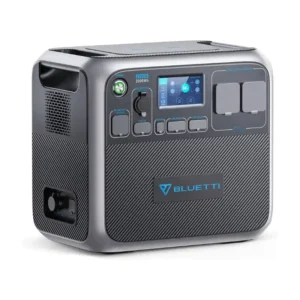 A front and side studio photo of the BLUETTI AC200P portable power station on a white background, featuring a silver-grey chassis, dark front control panel, touchscreen display showing 50% battery capacity, dual wireless charging pads, and multiple covered AC, DC, and USB ports.