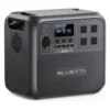 Studio product image of the BLUETTI AC180 portable power station, showing its dark gray composite body, front LCD display, 1,152 Wh battery capacity, AC outlets, USB ports, DC output, and wireless charging pad.