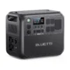 A studio product photo of the BLUETTI AC200L portable power station against a white background, showing its rugged dark gray casing, central display with 80% battery capacity, side input panel, and multiple covered AC, DC, and USB outputs.