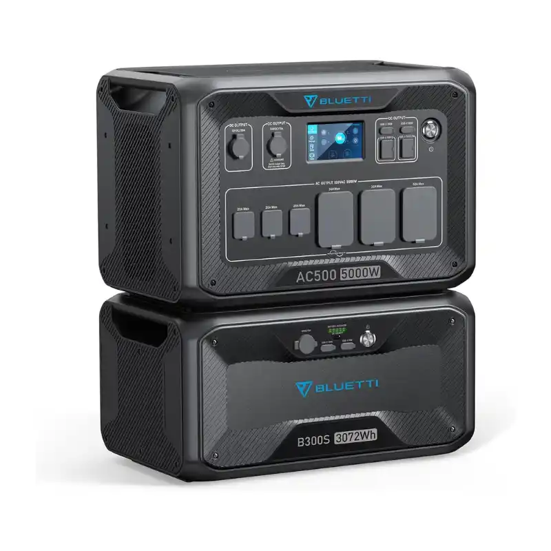 A studio product photo of the stacked BLUETTI AC500 + B300S modular power system, showing the 5,000W inverter on top of the 3,072Wh LiFePO4 expansion battery against a clean white background.