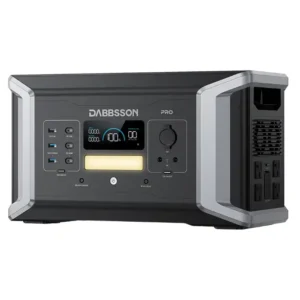 A studio product image of the Dabbsson 1000 Pro portable power station on a white background, featuring a black chassis with angular silver accents, a central LCD screen above a warm LED light panel, multiple front USB and DC ports, and side-mounted AC outlets.