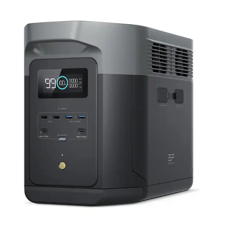 A studio product photo of the EcoFlow DELTA 2 Max portable power station against a white background, showing its silver and black chassis, front LCD display at 100% battery capacity, multiple USB outputs, and side-mounted expansion battery ports.