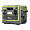 A front and side studio photo of the FOSSiBOT F2400 portable power station on a white background, featuring a dark grey and black chassis with neon lime green accents, a display showing 100% battery capacity, a central LED light bar, a rotary AC charging control dial, and multiple covered AC, DC, and USB ports.