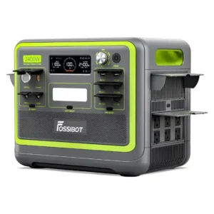A front and side studio photo of the FOSSiBOT F2400 portable power station on a white background, featuring a dark grey and black chassis with neon lime green accents, a display showing 100% battery capacity, a central LED light bar, a rotary AC charging control dial, and multiple covered AC, DC, and USB ports.