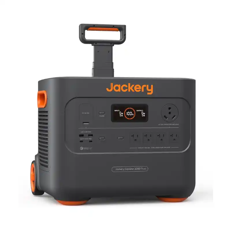 A studio product photo of the Jackery Explorer 2000 Plus portable power station with its telescoping handle extended, showing its dark gray body, bright orange accents, integrated wheels, and comprehensive front-facing output panel against a white background.