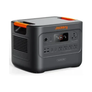 A studio product photo of the Jackery HomePower 3000 portable power station on a white background, showing its dark gray chassis, bright orange handle accents, front LCD display, multiple AC and USB outputs, dedicated 30A RV outlet, side cooling vents, and integrated transport wheel.