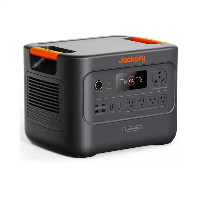 A studio product photo of the Jackery HomePower 3000 portable power station on a white background, showing its dark gray chassis, bright orange handle accents, front LCD display, multiple AC and USB outputs, dedicated 30A RV outlet, side cooling vents, and integrated transport wheel.
