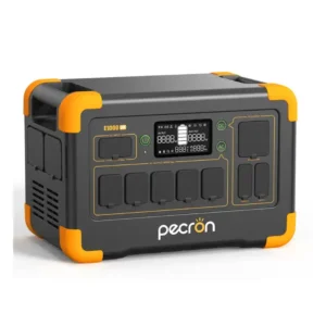 A studio product photo of the Pecron E1000LFP portable power station, showing its rugged gray-and-black chassis with bright orange accents, rubber-covered ports, a central digital display, and integrated carrying handles.