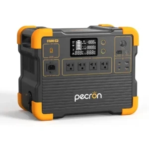 Pecron E1500LFP portable power station in a studio shot against a white background, showing its dark grey body, orange protective corner bumpers, central display, four AC outlets, and DC and USB ports.