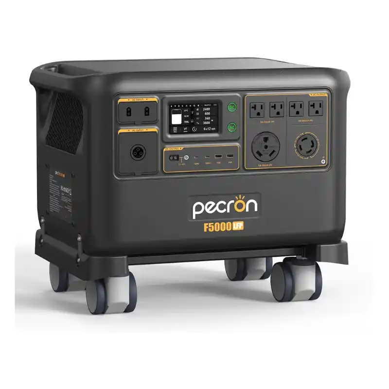 A front-angled studio photo of the Pecron F5000LFP whole-home backup power station on a white background, featuring a dark grey body, bright orange protective corner bumpers, four swiveling caster wheels, a central digital display, and multiple AC and DC outlets.