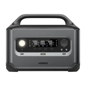 A symmetrical front product photo of the UGREEN PowerRoam 1200 portable power station on a white background, displaying its grey body, an active front display showing 100% battery, an illuminated LED light, and a curved top carry handle.