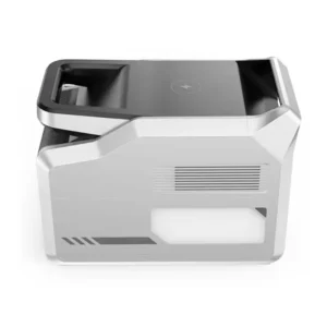 A high-angle side product photo of the VigorPool Captain 1200 portable power station on a white background, showing its silver-white casing, flat black top with an integrated wireless charging pad icon, side cooling vents, and a large built-in rectangular LED ambient light.