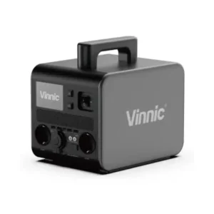 A studio product photo of the Vinnic PS700W portable power station on a white background, displaying its robust silver-grey aluminum body, integrated stackable top handle, front LCD display, and industrial-style toggle switches and outlets.