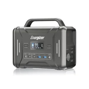 Energizer PPS320 320Wh portable power station shown at an angle on a reflective white studio surface, featuring a dark grey body, top carrying handle, front LCD display, vertical white LED light strips, two side-mounted AC outlets, and a 12V car socket.